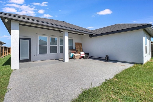 4102 Fold Ln, Corpus Christi, TX 78414 - back of house with a patio area, a lawn, roof with shingles, and stucco siding