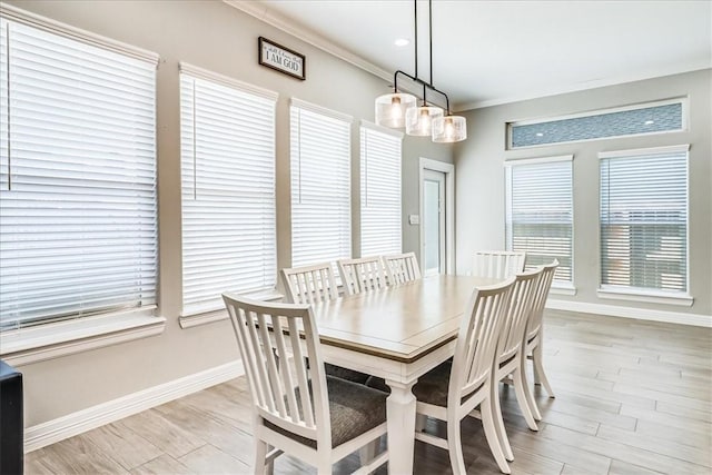 4102 Fold Ln, Corpus Christi, TX 78414 - dining room featuring plenty of natural light, crown molding, and light wood-style floors
