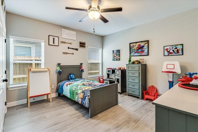 4102 Fold Ln, Corpus Christi, TX 78414 - bedroom featuring multiple windows, light wood-style flooring, and a ceiling fan