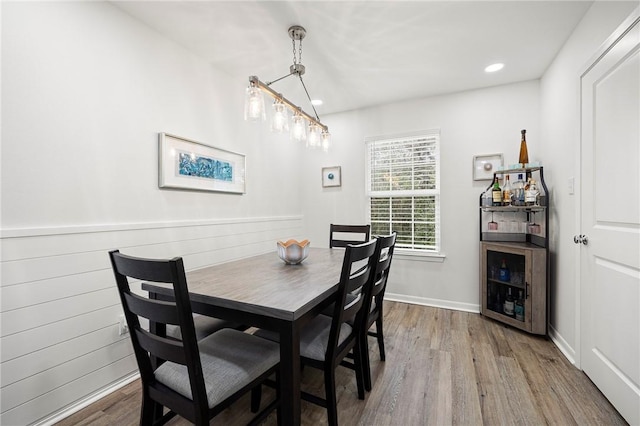 607 Huisache Lane, Ingleside On The Bay, TX 78362 - dining area with wood finished floors, beverage cooler, and recessed lighting