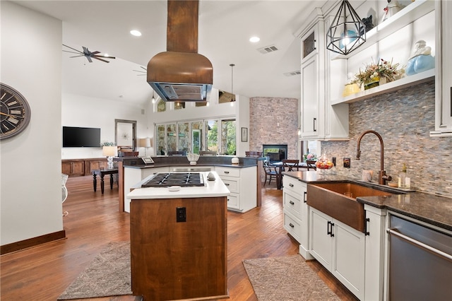 5502 E Riverview Dr, Corpus Christi, TX 78410 - kitchen featuring stainless steel appliances, a kitchen island, open floor plan, a stone fireplace, and recessed lighting