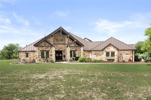 5502 E Riverview Dr, Corpus Christi, TX 78410 - view of front facade featuring a standing seam roof, stone siding, a front lawn, and a metal roof