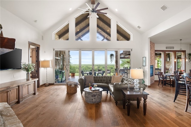5502 E Riverview Dr, Corpus Christi, TX 78410 - living area featuring ceiling fan, plenty of natural light, wood-type flooring, and high vaulted ceiling
