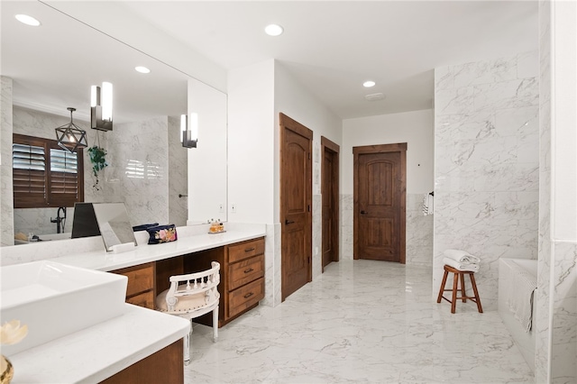 5502 E Riverview Dr, Corpus Christi, TX 78410 - full bathroom featuring tile walls, vanity, recessed lighting, and marble tiled floors