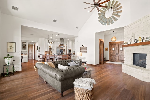 5502 E Riverview Dr, Corpus Christi, TX 78410 - living area featuring high vaulted ceiling, wood-type flooring, a stone fireplace, and recessed lighting