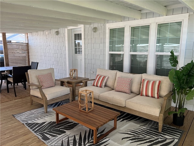 exterior space featuring hardwood / wood-style flooring and beamed ceiling