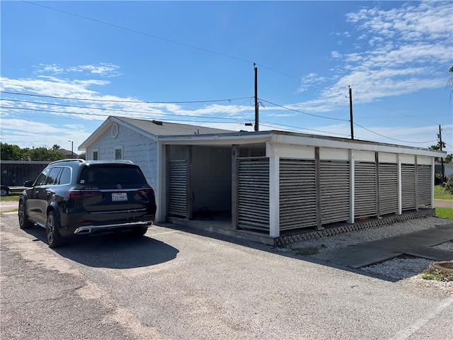 exterior space with a carport