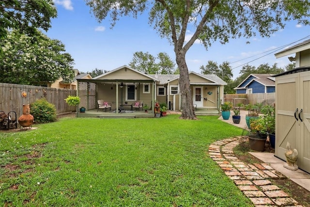 934 Cunningham St, Corpus Christi, TX 78411 - back of house featuring a patio, a fenced backyard, and an outdoor structure
