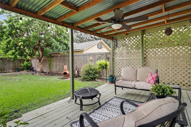 934 Cunningham St, Corpus Christi, TX 78411 - wooden deck with a fenced backyard, a ceiling fan, and an outdoor living space with a fire pit