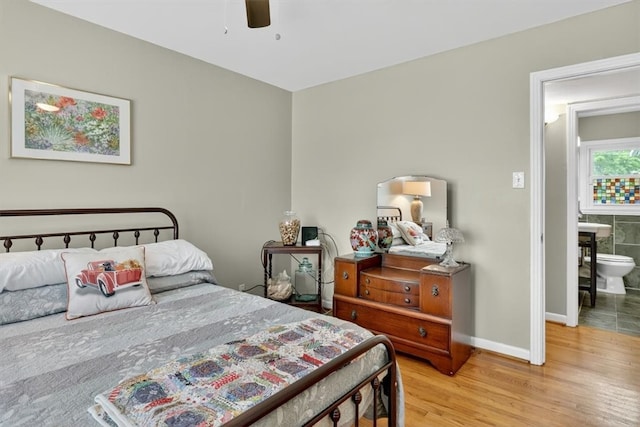 934 Cunningham St, Corpus Christi, TX 78411 - bedroom featuring light wood-style floors, ensuite bath, and a ceiling fan
