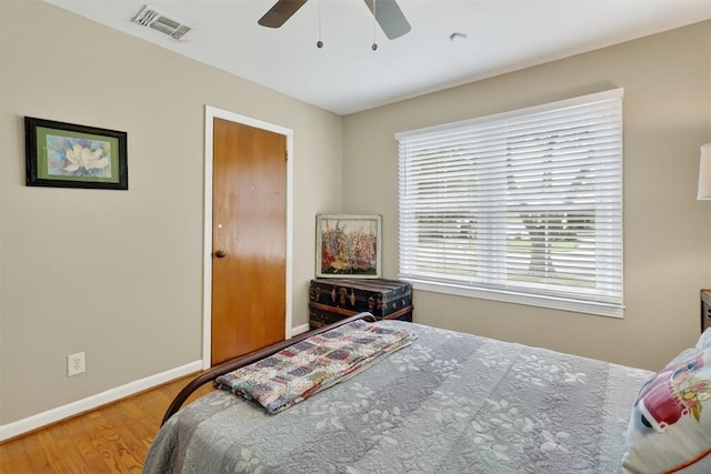 934 Cunningham St, Corpus Christi, TX 78411 - bedroom featuring multiple windows, wood finished floors, and ceiling fan