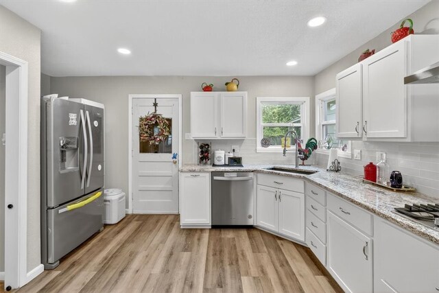 934 Cunningham St, Corpus Christi, TX 78411 - kitchen featuring stainless steel appliances, white cabinetry, light wood-type flooring, and recessed lighting