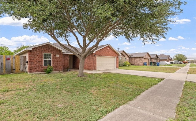 single story home featuring driveway, an attached garage, fence, a front yard, and brick siding
