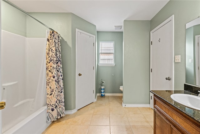 bathroom featuring tile patterned flooring, visible vents, vanity, shower / tub combo with curtain, and baseboards