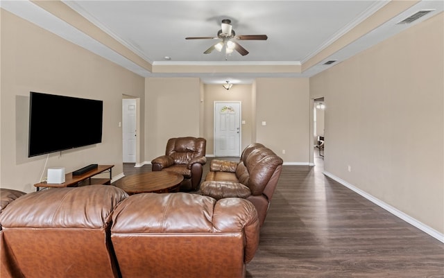 living room featuring baseboards, a ceiling fan, visible vents, and dark wood-style flooring
