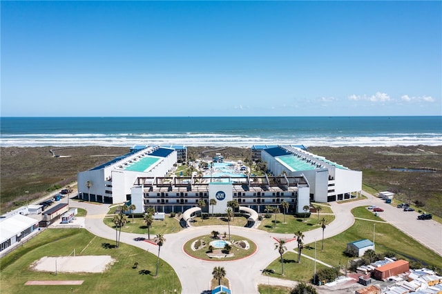 bird's eye view featuring a view of the beach and a water view