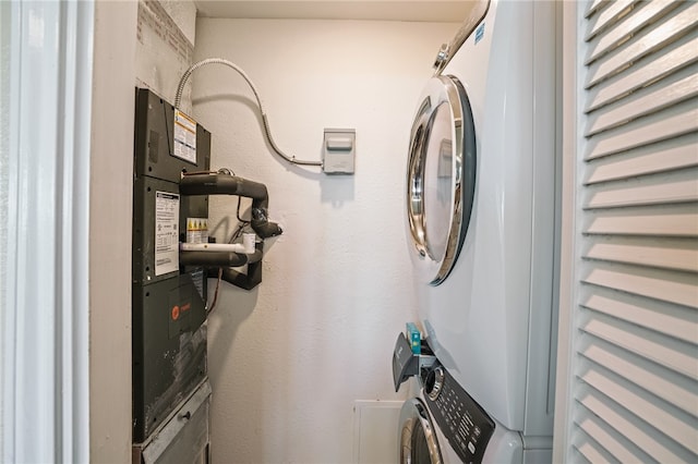 laundry area with stacked washer / dryer