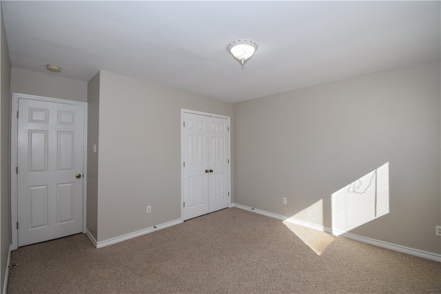 empty room with light colored carpet