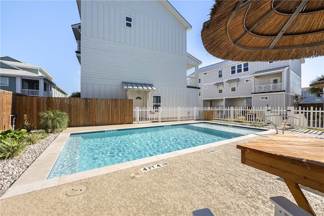 view of swimming pool with a patio area