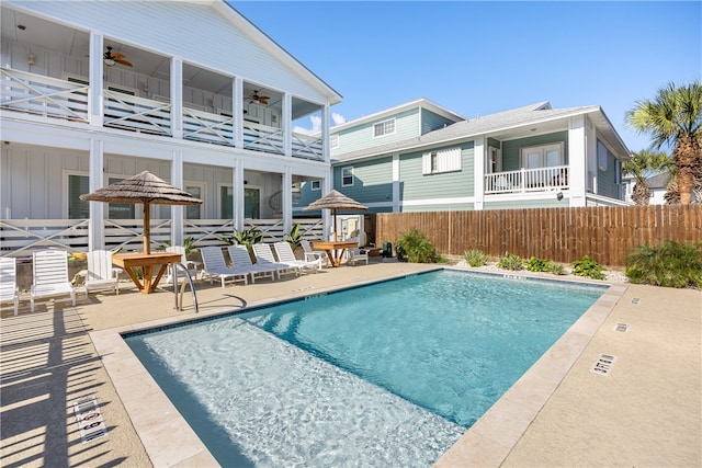 view of swimming pool with a gazebo, ceiling fan, and a patio