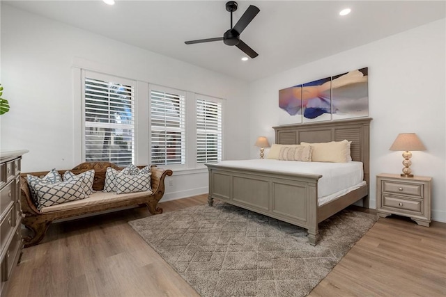 bedroom featuring recessed lighting, baseboards, ceiling fan, and light wood finished floors