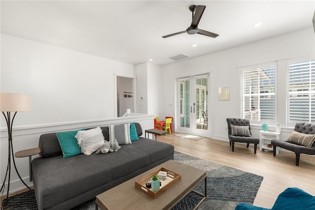 living area featuring light wood finished floors, visible vents, ceiling fan, french doors, and recessed lighting