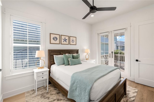 bedroom with baseboards, light wood-style flooring, access to exterior, french doors, and recessed lighting