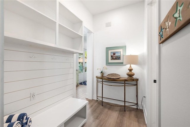 mudroom with light wood finished floors