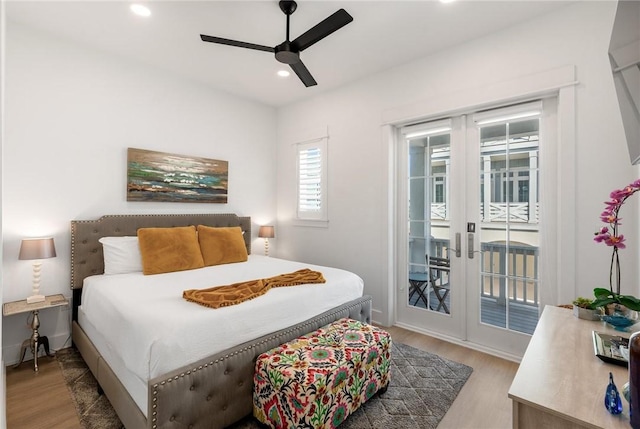 bedroom featuring access to exterior, recessed lighting, french doors, and light wood-style flooring