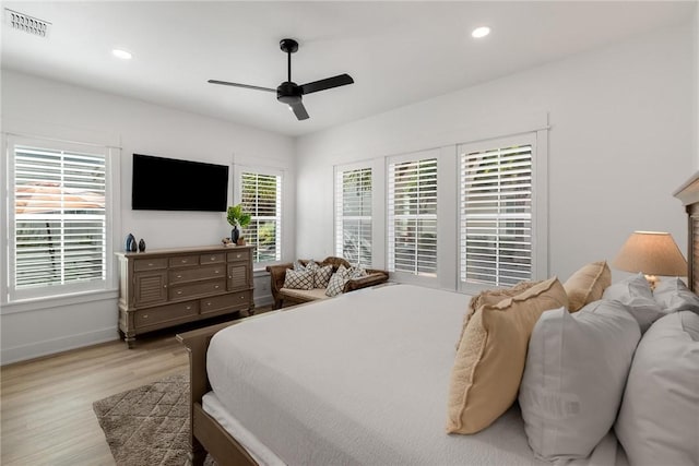 bedroom featuring visible vents, baseboards, light wood-style flooring, ceiling fan, and recessed lighting