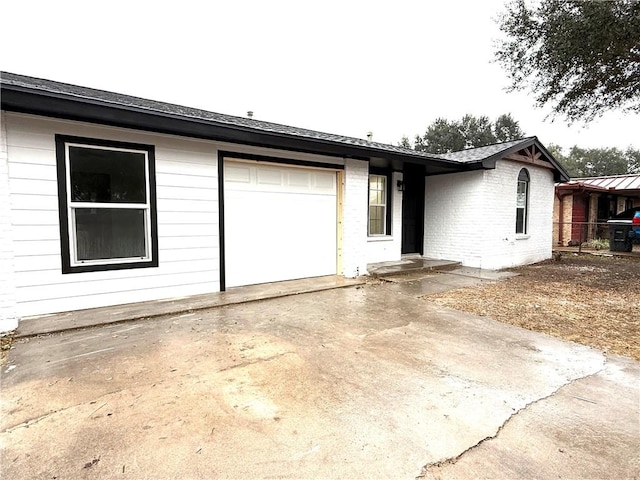 ranch-style home with a garage