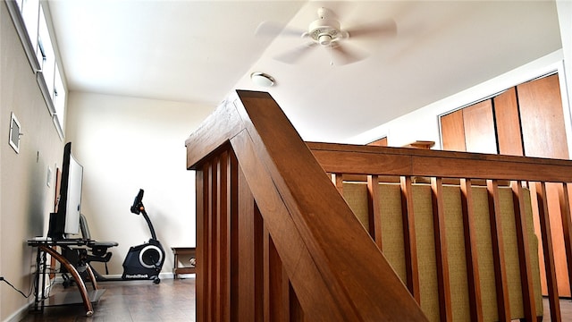 staircase featuring ceiling fan and lofted ceiling