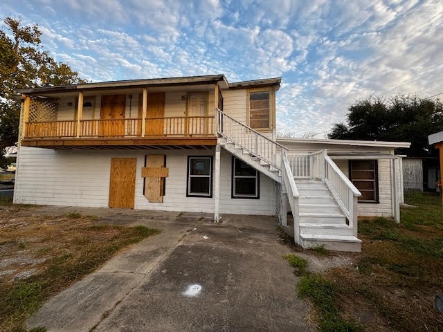 back of house with a balcony