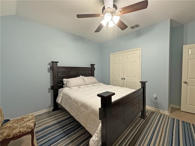 177 Whistlers Cv, Rockport, TX 78382 - carpeted bedroom with ceiling fan, baseboards, and a closet