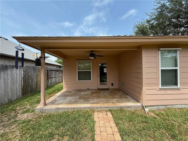 177 Whistlers Cv, Rockport, TX 78382 - entrance to property featuring ceiling fan, a patio area, and fence