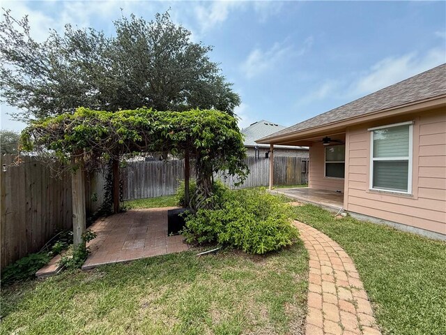 177 Whistlers Cv, Rockport, TX 78382 - view of yard featuring a patio and ceiling fan