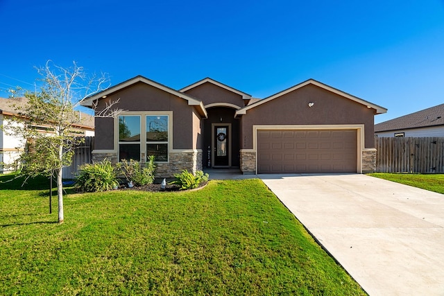 view of front of property featuring a garage and a front yard