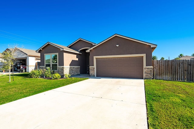 view of front of house with a garage and a front lawn