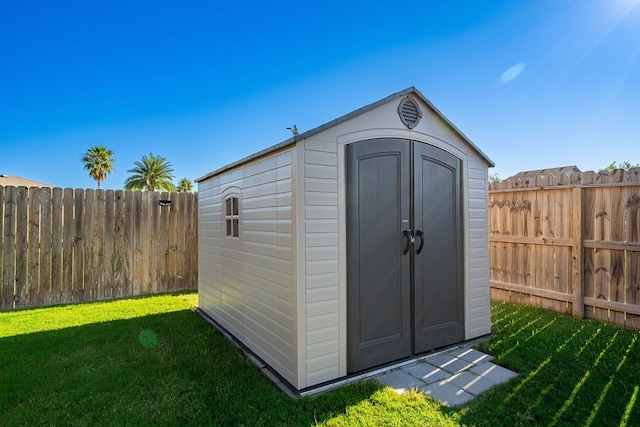 view of outbuilding featuring a lawn