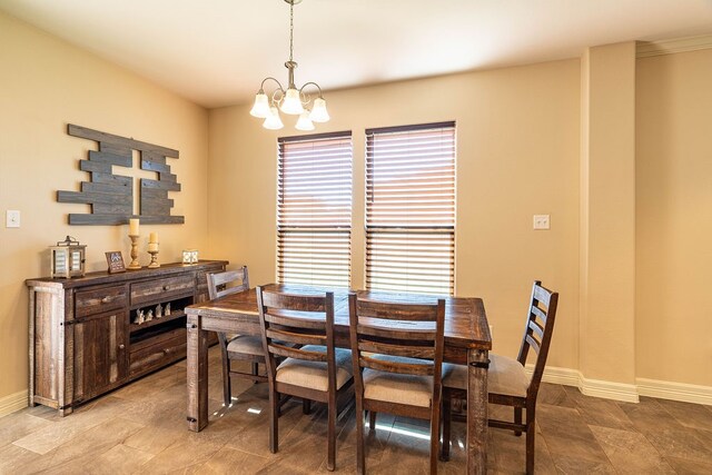 dining area featuring a notable chandelier