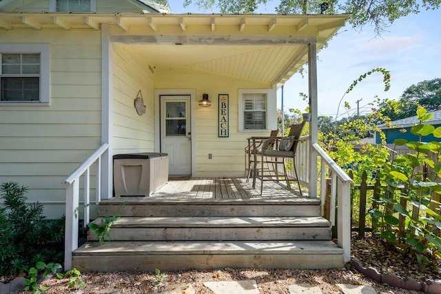 property entrance featuring a deck