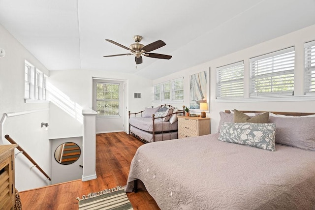 bedroom featuring lofted ceiling, ceiling fan, and dark wood-type flooring