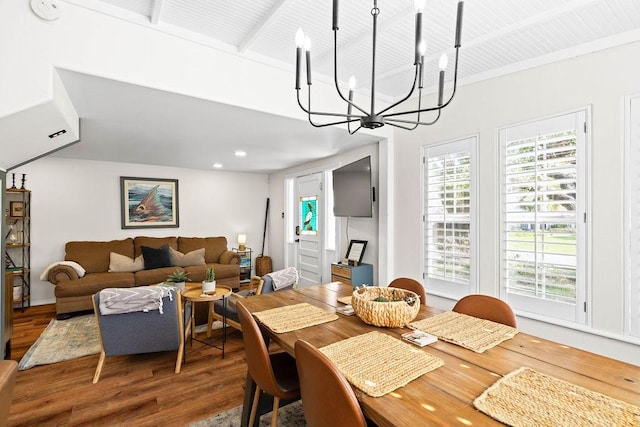 dining room with hardwood / wood-style flooring and a notable chandelier