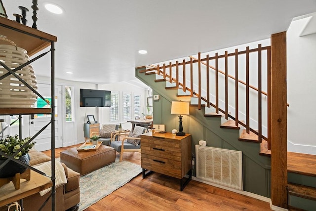 interior space with radiator heating unit and hardwood / wood-style flooring