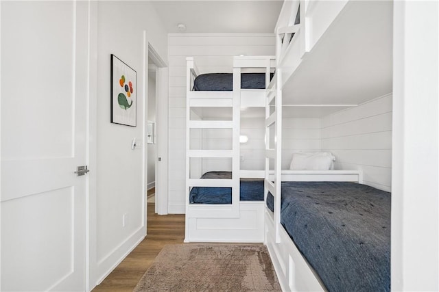 320 S Shore Dr, Port Aransas, TX 78373 - unfurnished bedroom featuring wood finished floors and baseboards