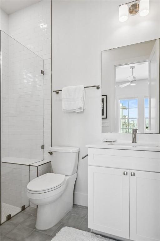 320 S Shore Dr, Port Aransas, TX 78373 - full bathroom with a stall shower, vanity, tile patterned floors, and a ceiling fan