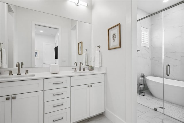 320 S Shore Dr, Port Aransas, TX 78373 - full bath featuring marble finish flooring, double vanity, a marble finish shower, and recessed lighting