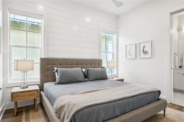 320 S Shore Dr, Port Aransas, TX 78373 - bedroom featuring wood finished floors and ensuite bathroom
