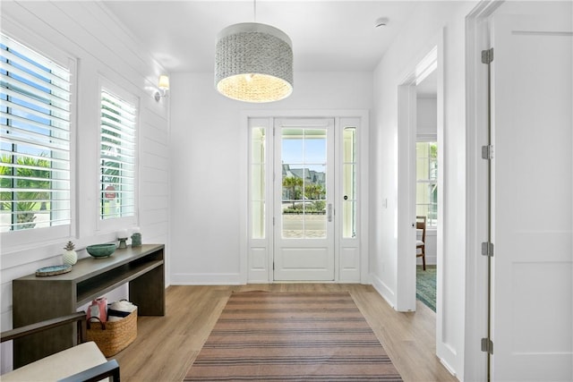 320 S Shore Dr, Port Aransas, TX 78373 - entryway featuring plenty of natural light and light wood-style floors