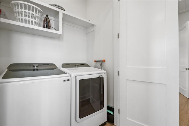 320 S Shore Dr, Port Aransas, TX 78373 - laundry room with separate washer and dryer and wood finished floors